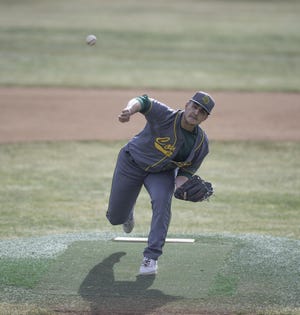 Pueblo County High School’s Cole Martino delivers a pitch against Woodland Park on March 21, 2019. [Chieftain file photo]