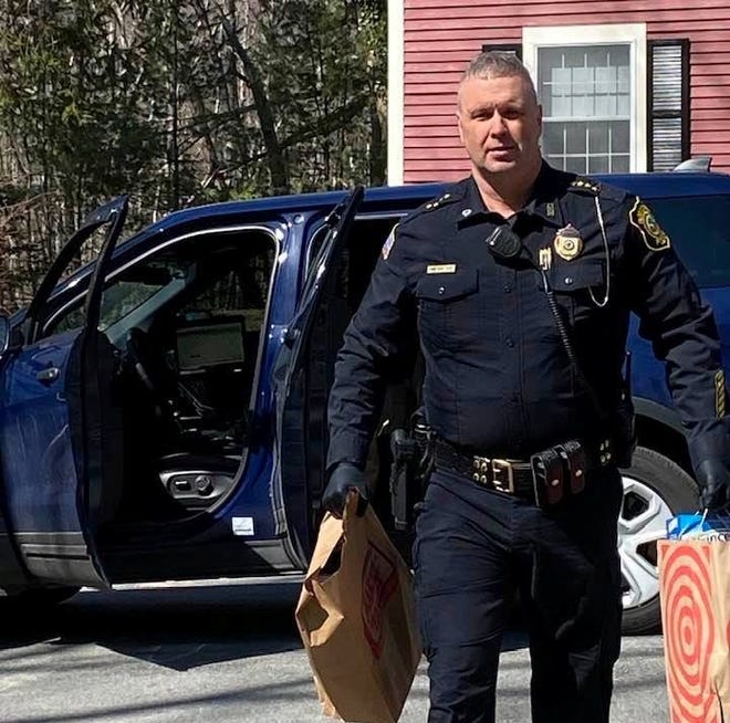Boxford Police Chief James Riter delivers food and supplies to residents at Four Mile Village. [Courtesy Photo]