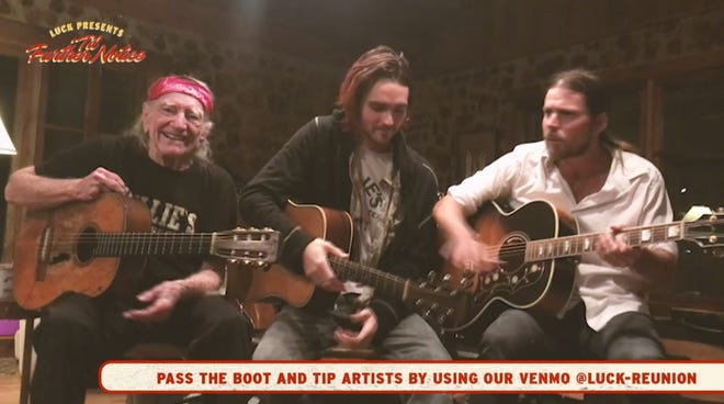 Willie Nelson is joined by sons Micah, center, and Lukas during the finale of “Til Further Notice,” a livestream event that took the place of the annual Luck Reunion Thursday night. [Screenshot from livestream]