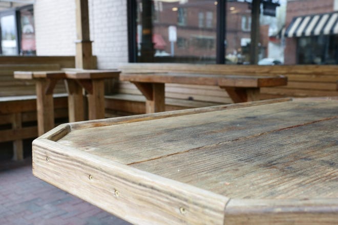 Saturday gave us a look at the new normal with outdoor seating unoccupied at Sugar Hill Pizzeria on March 21 after restaurants were ordered to have patrons take out food and leave due to the coronavirus outbreak. [Brandon Davis/Kinston Free Press]