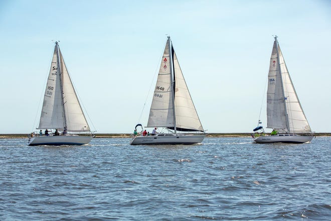 Sailboats race to the buoy during the Geechee Sailing Club's 41st annual St. Patrick's Regatta on Saturday on the Wilmington River. [BEN BRENGMAN/SAVANNAHNOW.COM]