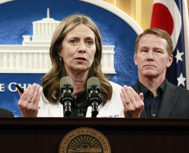 Ohio Department of Health director Dr. Amy Acton speaks at a press conference about coronavirus with Governor Mike DeWine, and Lt. Governor Jon Hustead, right, Wednesday, March 11, 2020 at the Ohio Statehouse. [Barbara J. Perenic/Dispatch]