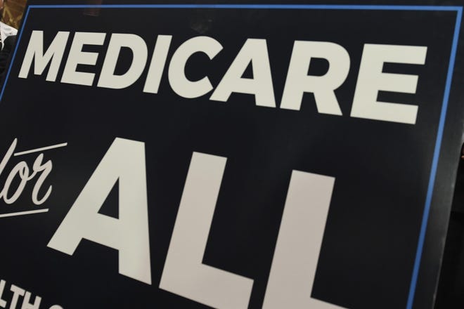 A sign is shown at a news conference announcing Medicare for All legislation in Washington [AP Photo/Susan Walsh, File]