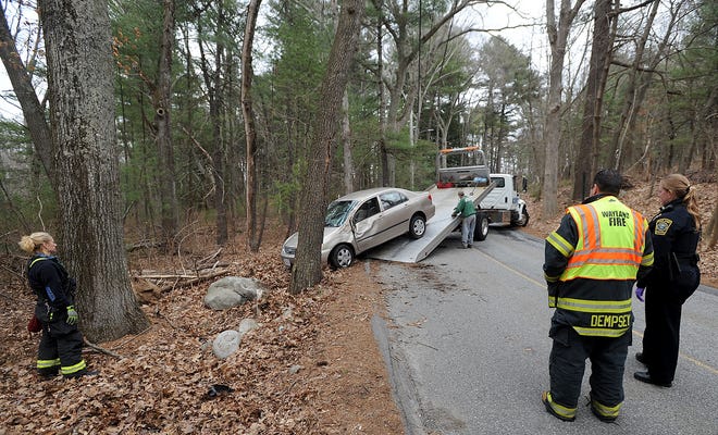 The 32-year-old driver of this Toyota, a Sudbury woman whose name was not released by police, was taken to Lahey Hospital by ambulance on Monday, after crashing into a tree on Sherman's Bridge Road. [Daily News and Wicked Local Staff Photo/Art Illman]