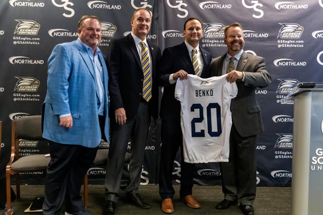 From left to right, Georgia Southern Athletic Foundation co-chairs Leonard Bevill and Anthony Tippins, new athletic director Jared Benko and President Kyle Marrero, who presented Benko with an Eagles No. 20 jersey (for the year 2020) on March 9 at Bishop Field House in Statesboro. [AJ HENDERSON/GEORGIA SOUTHERN ATHLETICS]