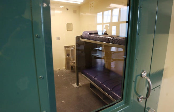 Bolted-down metal bunks, shown in a cell in Building 12, are standard issue at the Travis County jail. [RODOLFO GONZALEZ/AMERICAN-STATESMAN/FILE]