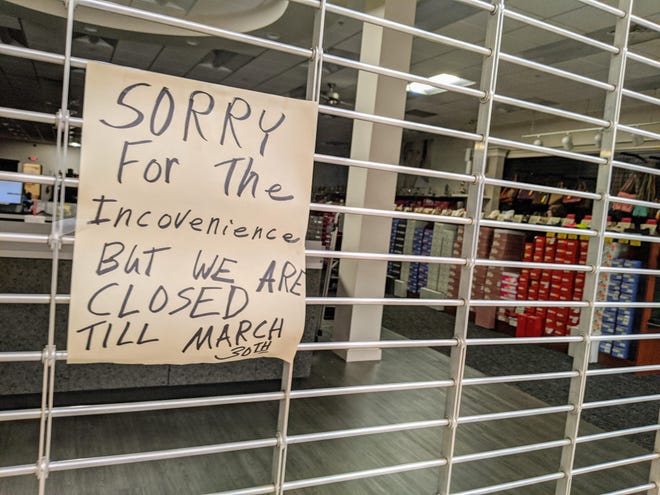 A letter on the gate of a shoe store at the Oxford Valley Mall informs customers of Gov. Tom Wolf’s order to close all nonessential business due to the coronavirus. [ANTHONY DIMATTIA / STAFF PHOTOJOURNALIST]