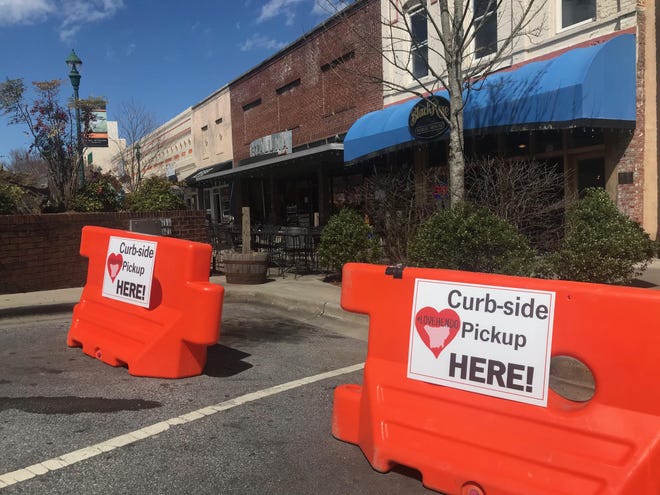 Curbside pickup in downtown Hendersonville. [PATRICK SULLIVAN/TIMES-NEWS]