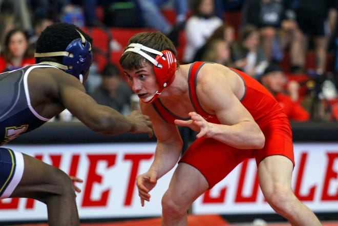 Olivet's Cameron Mahlich (right) competes in a match this season. [Contributed/Olivet College Athletics]