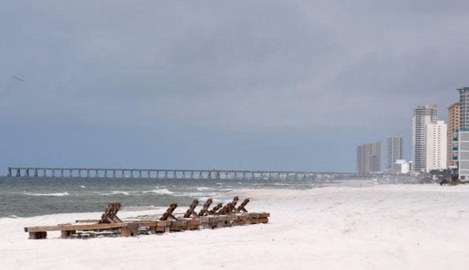 A clear beach was a clear sign Monday that locals were heeding the decision to shut down Panama City Beach’s sandy white beach. NATHAN COBB/THE NEWS HERALD