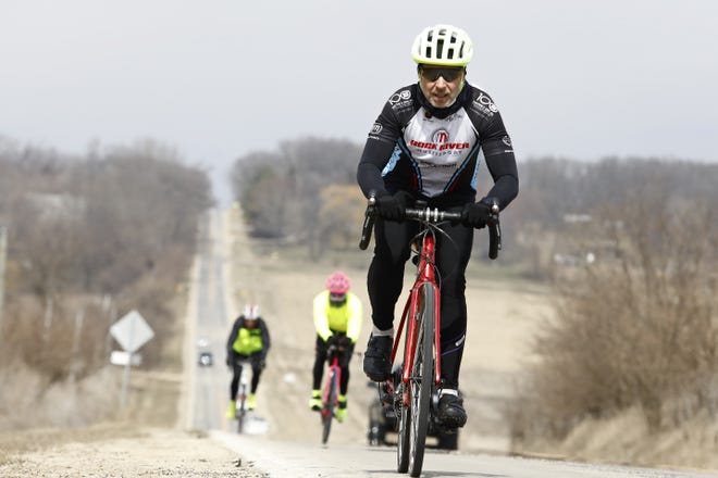 Rick Green of Roscoe rides his bike with a small group of fellow Rock River Multi Sport members Wednesday, March 25, 2020, on Old River Road in Rockton. [SUSAN MORAN/RRSTAR.COM CORRESPONDENT]