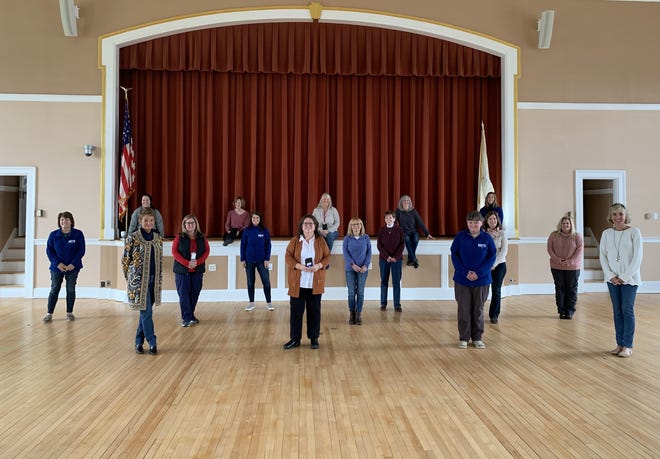 Braintree school nurses pose for a photo in town hall's Cahill Auditorium to demonstrate social distancing.

Courtesy Photo