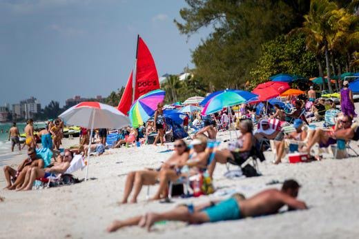 Crowds fill the shore at Bonita Beach in Bonita Springs on Wednesday, March 18, 2020. [Alex Driehaus/Naples Daily News/USA TODAY - FLORIDA NETWORK]