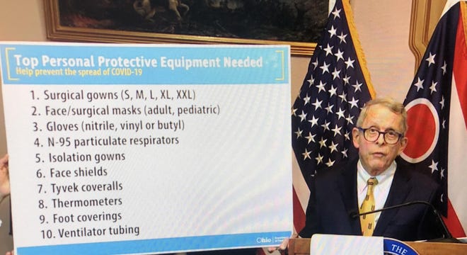 Ohio Gov. Mike DeWine reviews personal protective equipment the state needs during his coronavirus briefing Saturday at the Statehouse in Columbus. [Ohio Channel video image]