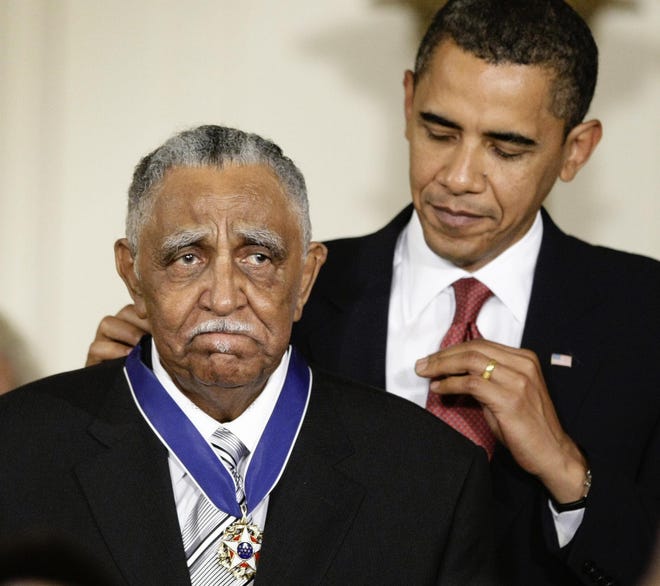 President Barack Obama presents a 2009 Presidential Medal of Freedom to the Rev. Joseph E. Lowery in the East Room of the the White House on Aug. 12, 2009, in Washington. Lowery, a veteran civil rights leader who helped the Rev. Dr. Martin Luther King Jr. found the Southern Christian Leadership Conference and fought against racial discrimination, died Friday at 98. [J. Scott Applewhite/The Associated Press]