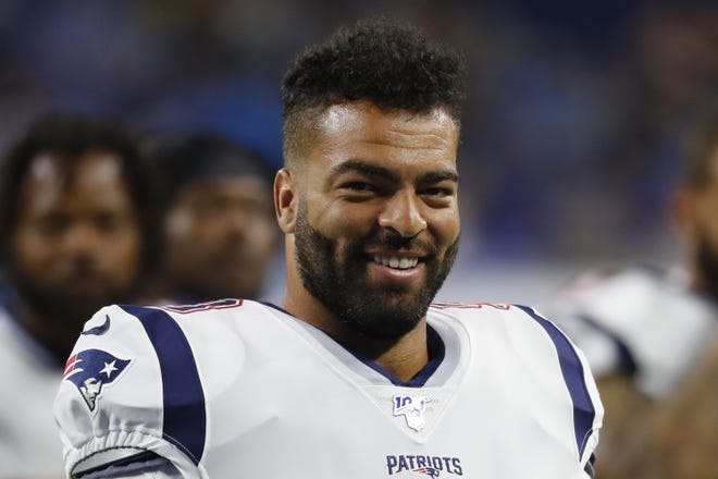 Former New England Patriots middle linebacker Kyle Van Noy smiles on the field during a preseason game against the Detroit Lions in Detroit last August. The Miami Dolphins added Van Noy via free agency on March 16. [AP File Photo/Paul Sancya]