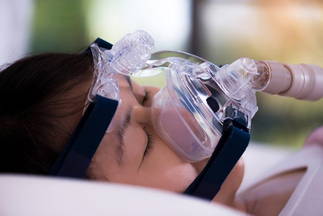 With a diagnosis of sleep apnea, a patient is typically prescribed a continuous positive airway pressure (CPAP) machine. The equipment is not an acceptable replacement for ventilators, however. (Somsak Bumroongwong/Dreamstime/TNS)