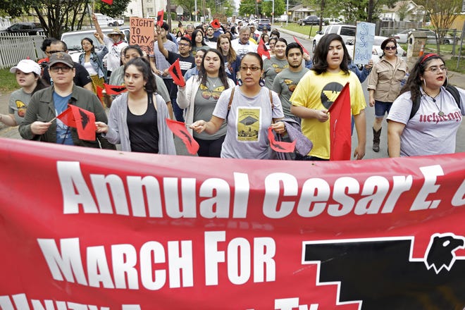 A group of supporters for equal rights march down East 3rd Street for the annual Cesar E. Chavez "Si Se Puede!" March in 2019. [CARLOS GARCIA/ AUSTIN AMERICAN STATESMAN]