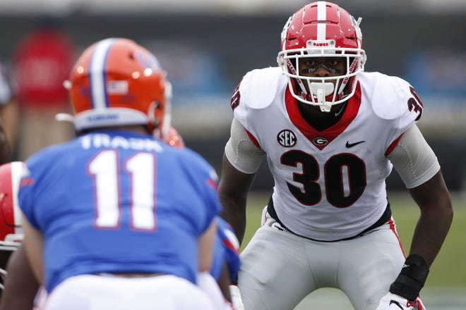 Georgia inside linebacker Tae Crowder (30) looks in on Florida quarterback Kyle Trask (11) in the first half of last year’s game in Jacksonville, Fla. [Photo/Joshua L. Jones, Athens Banner-Herald]
