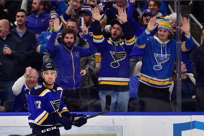 St. Louis Blues fans celebrate after left wing Jaden Schwartz (17) scored during a game against the Vegas Golden Knights on Dec. 12 at Enterprise Center. [Jeff Curry/USA TODAY Sports]