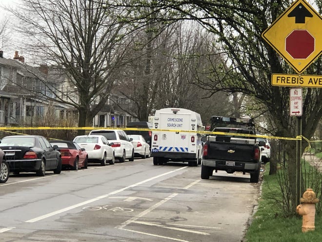 Columbus Division of Police crime scene technicians collect evidence on Wednesday, April 1, 2020 on the 1400 block of South Ohio Avenue after an officer-involved shooting left an officer and a suspect injured. [Bethany Bruner/Dispatch]