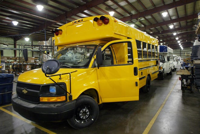 Buses sit on the line at Collins Bus manufacturing plant in South Hutchinson in this file photo. The plant has delayed ramping up its seasonal work due to the COVID-19 pandemic. [Hutchnews file]