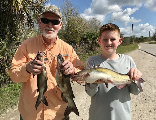 Lakeland residents Michael Hicks, 69, left, and his grandson Lucas Berry, 13, caught these channel catfish at Tenoroc Fish Management Area recently. [ PROVIDED BY PAOLO PECORA/FWC ]