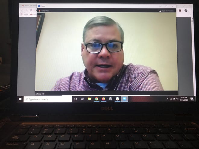 Johnny Hill, assistant superintedent of Business, Financial & Auxiliary Services, provides the school board an update on purchases in the district during a meeting March 25 held on Zoom. [LAKE TRAVIS VIEW]