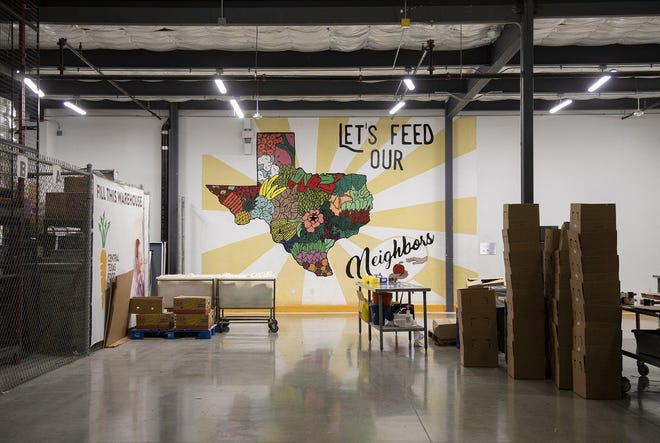 Volunteers pack items into "emergency boxes" at the Central Texas Food Bank on March 16, 2020. [ANA RAMIREZ/AMERICAN-STATESMAN]