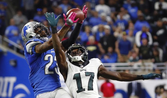 Lions cornerback Darius Slay (23) intercepts a pass intended for Eagles wide receiver Nelson Agholor. [PAUL SANCYA / ASSOCIATED PRESS FILE]