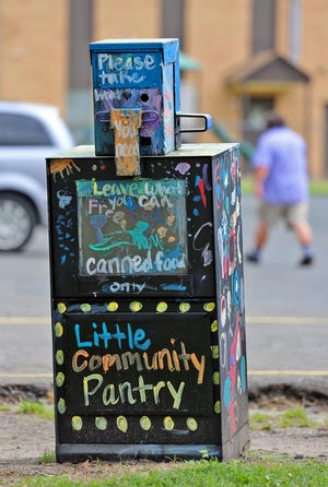 Little Community Pantries help keep people in need supplied with canned goods. [Brittany Randolph/The Star]