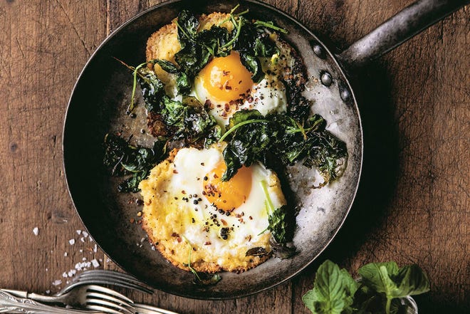 This fried egg from “Half Baked Harvest Super Simple” by Tieghan Gerard gets an extra layer of crunch from a fried disc of Parmesan cheese. [Contributed by Tieghan Gerard]