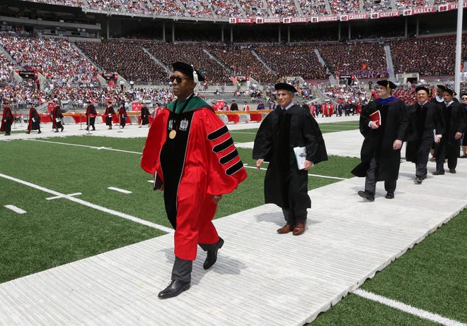 Ohio State University President Michael V. Drake leads a procession of faculty members during spring commencement at Ohio Stadium in 2016. [Dispatch file photo]