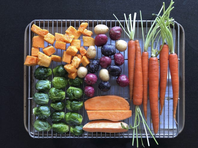 Various vegetables placed on a rack prior to roasting. [(Elizabeth Karmel via AP]