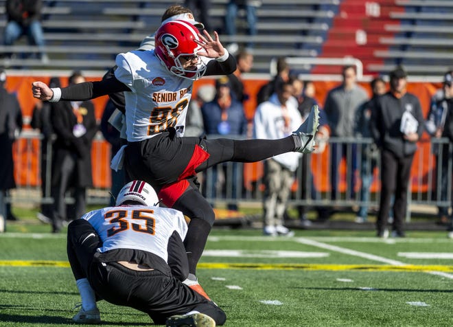 Rodrigo Blankenship of Georgia practices kicking a field goal out of the hold of punter Joseph Charlton of South Carolina during a Senior Bowl workout Jan. 21 at Ladd-Peebles Stadium in Mobile, Ala. [USA Today Sports / Vasha Hunt]