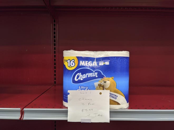 A "One Package per Household per Day" limit is requested for high demand on essential items like toilet paper being constantly restocked at the Gelson's Market in Los Feliz neighborhood of Los Angeles Thursday, March 26. [Damian Dovarganes/The Associated Press]