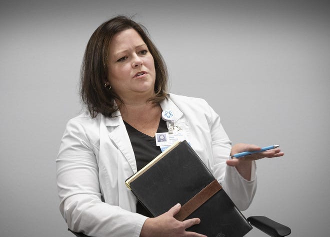 April Novotny, chief nurse at Lakeland Regional Health Medical Center, talks about the actions the hospital's leaders have taken to prepare for the continued penetration of COVID-19 into Polk County during a roundtable discussion with The Ledger last week. But even with new precautions, the hospital's front-line workers know infection is possible. [ERNST PETERS/THE LEDGER]