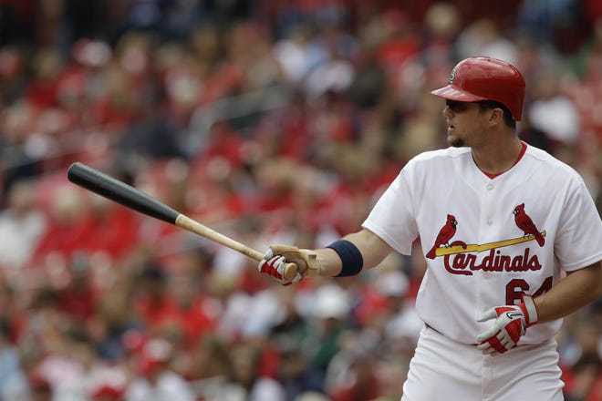 St. Louis Cardinals' Mark Hamilton bats during a baseball game against the Colorado Rockies in St. Louis in 2010. [Jeff Roberson/The Associated Press]