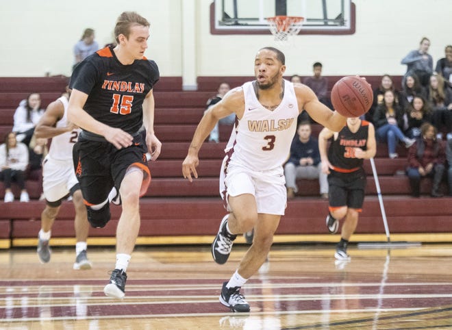 Walsh’s Darryl Straughter (3) pushes the ball with Findlay’s Ethan Linder on his heels during a Jan. 25, 2020 game. (CantonRep.com / Aaron Self)