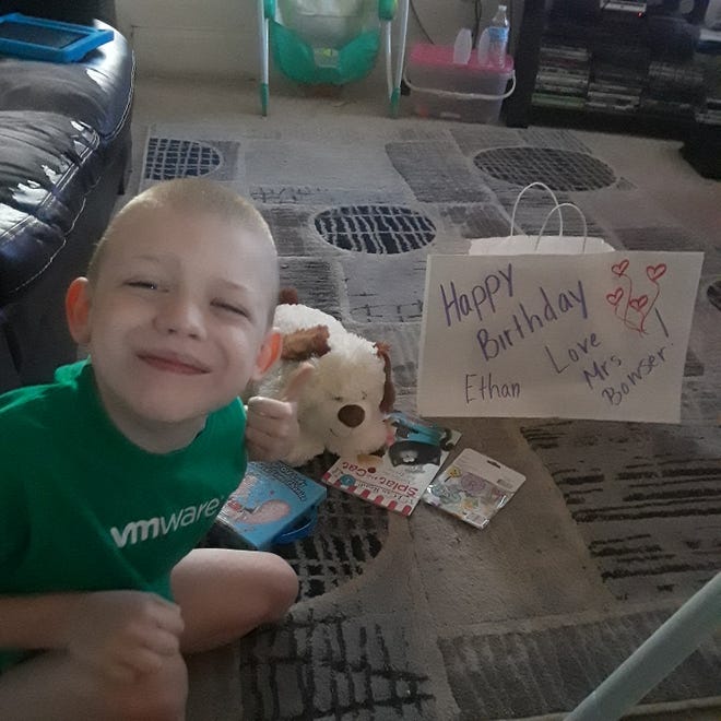 Ethan Kline, a student in Tracy Bowser's kindergarten class at Alliance Early Learning School, shows off the birthday gift Bowser left for him during the stay-at-home quarantine for the coronavirus crisis.