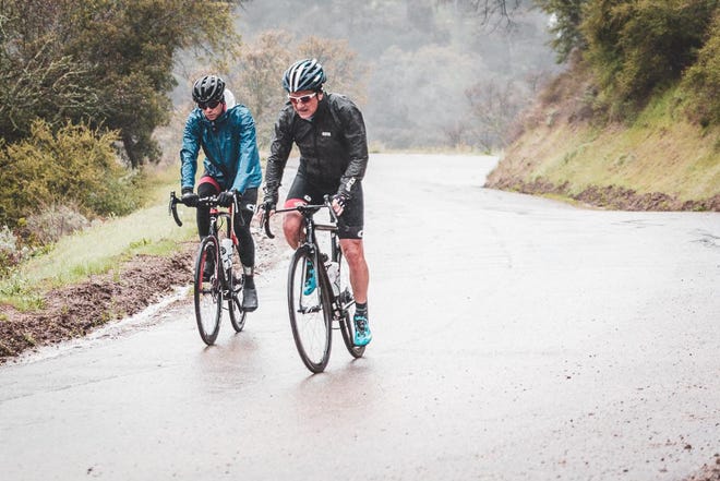 Yardley native Charlie Rowland (right), currently working for two companies active in the battle against the coronavirus pandemic, competes in cycle races all over the world. [CONTRIBUTED]