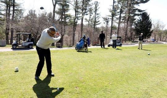 Carl Rogers of Yonkers tees off on the 10th hole at Maple Moor Golf Course in White Plains April, 6, 2020. Playing with him was Chris Durant of Yorktown, Jim Welsh of Mount Kisco, and Rob Wallace of Oradell, N.J. With golf courses in New Jersey closed due to the coronavirus pandemic, Wallace said he came to Maple Moor because the Westchester County public golf courses were the closest courses that remained open. New York State has now classified golf courses as non-essential businesses, meaning they will have to close at least until April 29.
