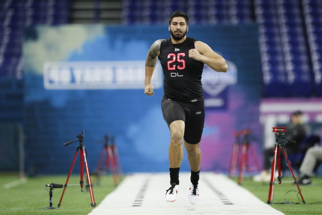 Iowa defensive lineman A.J. Epenesa could be an option for the Patriots with their first-round pick in the NFL Draft later this month. [Charlie Neibergall/The Associated Press]