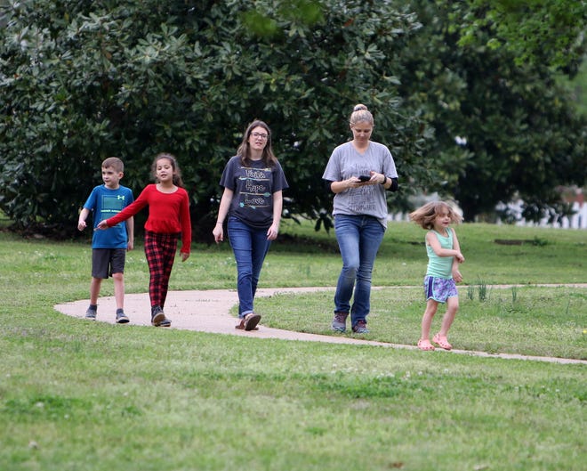 Eli Drost, 8, from left, Tynlee Wilson, 7, Katie Priest and Tabitha Fondren try keeping up with Emmi Drost, 4, as they walk around the Fort Smith National Historic Site, Tuesday, April 7, 2020. [JAMIE MITCHELL/TIMES RECORD]
