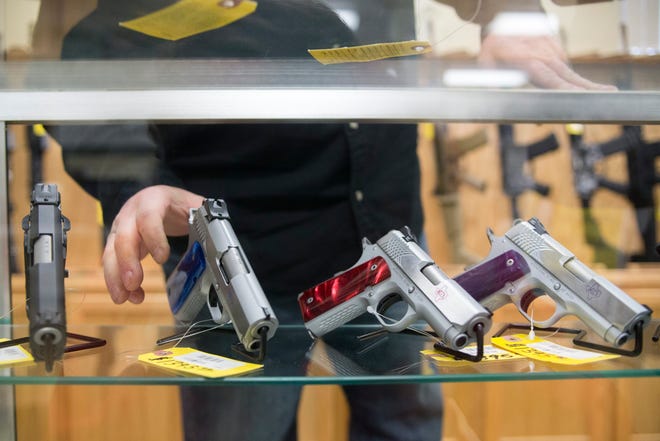 This file photo shows a selection of 9 mm handguns at Kapguns in Loves Park. Gun owners now have more time to renew a firearm owners identification card and concealed carry license in Illinois. [MAX GERSH/RRSTAR.COM]