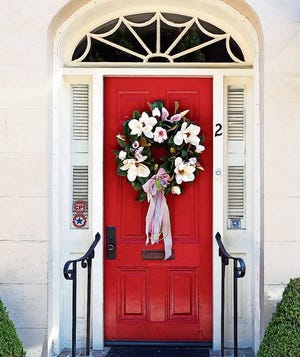 Update your front door decor for spring with craft items or silk flowers you may already have around the house. [SPENCERMEANS/FLICKR]
