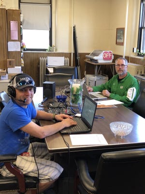 Wethersfield CUSD 230 IT Director Jason Phelps, left, and Supt. Shane Kazubowski set up an electronic meeting Wednesday for the Wethersfield School Board at the conference table in the unit office where it is normally takes place.[Photo provided]