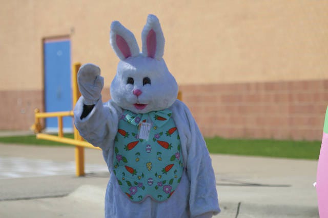 The Hy-Vee Easter Bunny waves to kids during the grab-and-go meal program on Friday, April 10 at Perry Elementary. PHOTO BY ANDREW BROWN/THE PERRY CHIEF