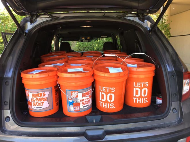 For its homeless ministry, Trinity Lutheran Church distributed in these buckets items that include various cleaning supplies, sponges and paper towels. [Provided photo]