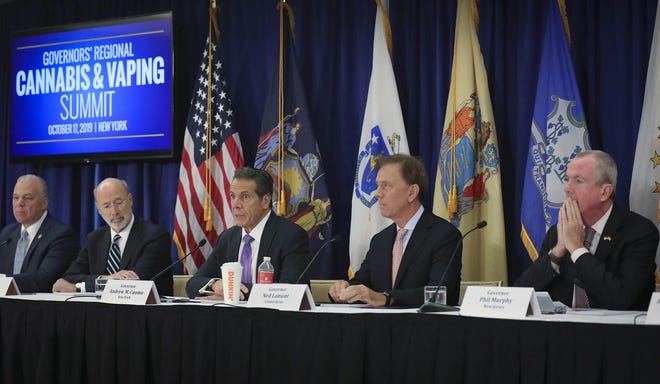 File - Pennsylvania Gov. Tom Wolf, second from left; New York Gov. Andrew Cuomo, center; Connecticut Gov. Ned Lamont, second from right; and New Jersey Gov. Phil Murphy, far right, co-host a regional summit on public health issues around cannabis and vaping Thursday, Oct. 17, in New York. Along with the governors of Rhode Island and Delaware, the group announced plans for a task force to discuss reopening the states. [BEBETO MATTHEWS / ASSOCIATED PRESS]